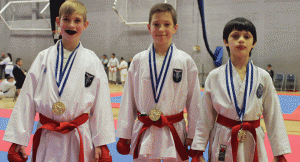 Jack,-Lewis-and-Callum-winning-Gold-in-team-Kumite-10-11yrs